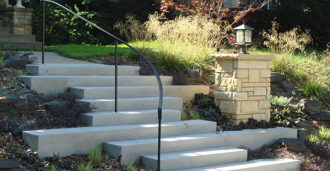 concrete terrace steps with handrail