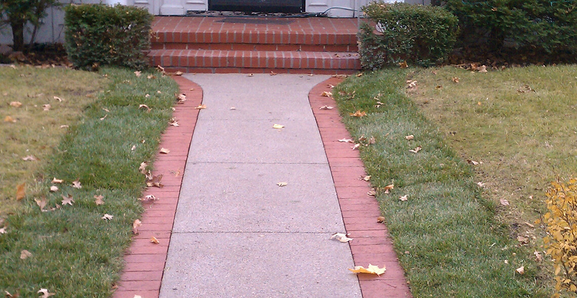 Vintage Finish concrete walkway with brick borders